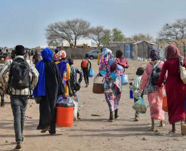 Civilians who fled the war-torn Sudan following the outbreak of fighting between the Sudanese army and the paramilitary Rapid Support Forces (RSF) walk at the Joda South border point, in Renk County, Upper Nile state, South Sudan April 30, 2023. REUTERS/Jok Solomun